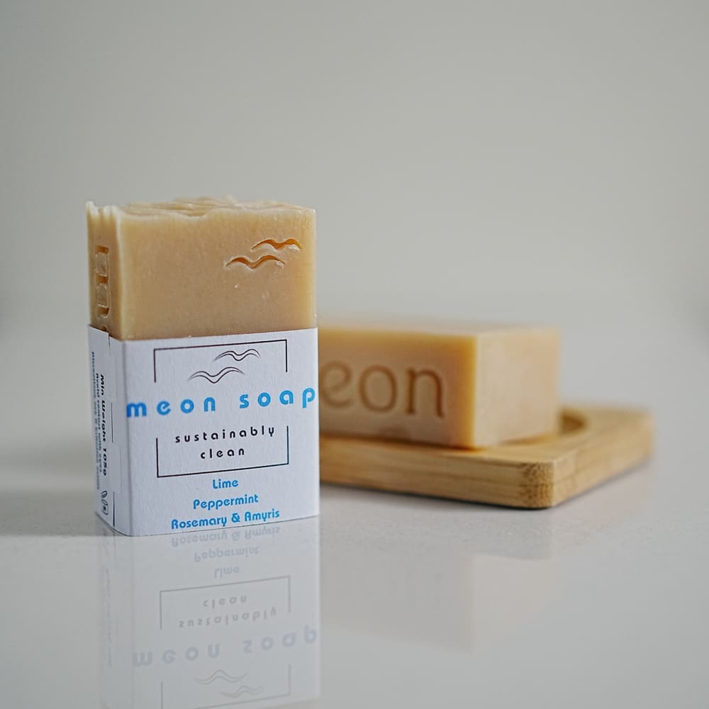 Natural coloured soap bar in wooden soap dish