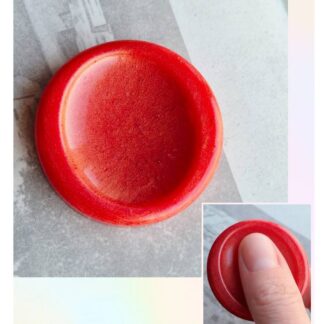Handmade resin worry stone on neutral background