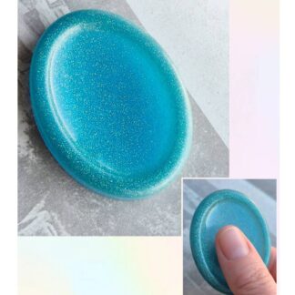 Teal resin worry stone with smooth thumb groove