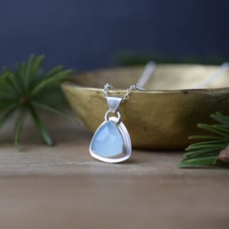 blue gemstone and sterling silver pendant