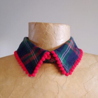 Detachable shirt collar in green and navy check fabric with red pom pom edge.