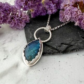 Handmade freeform labradorite necklace set in a sterling silver rubover setting