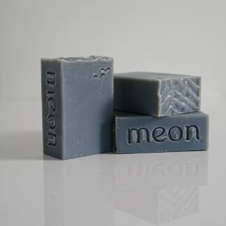 Grey soap bars with branded stamp and texture