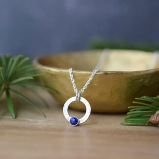 small silver open circle necklace with lapis lazuli stone