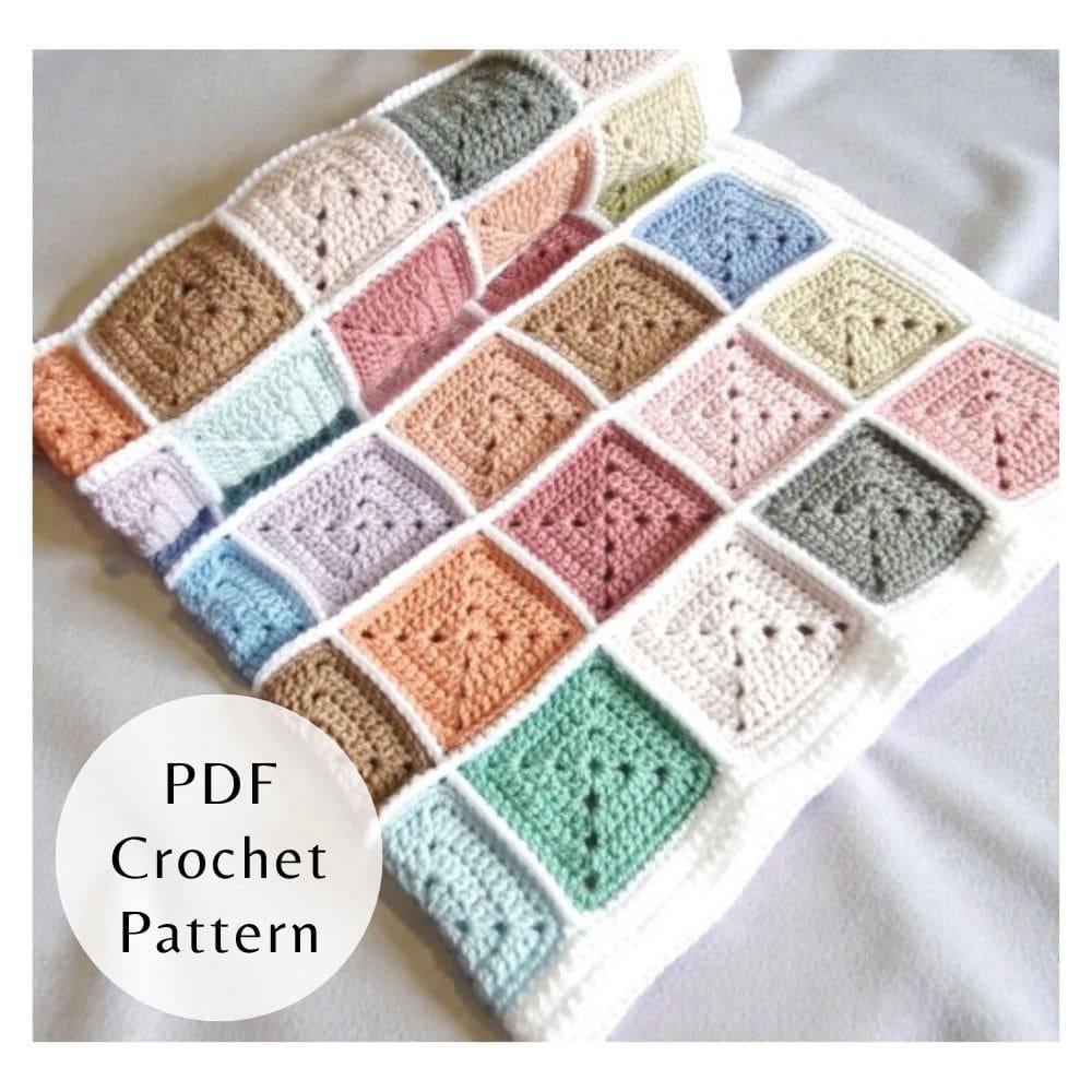 Digital PDF crochet pattern for a stash busting solid granny square baby blanket. Includes step-by-step photos and clear instructions for intermediate crocheters. A close up of squares.