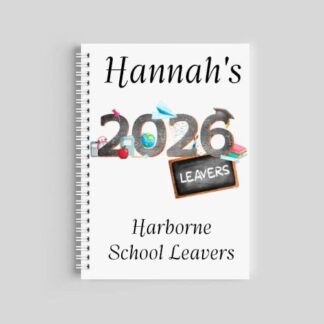 A spiral-bound A5 notebook with a white cover. It features the name "Hannah" at the top, a large "2026" graphic decorated with school supplies and a "Leavers" chalkboard, and "Harborne Primary School" printed at the bottom.