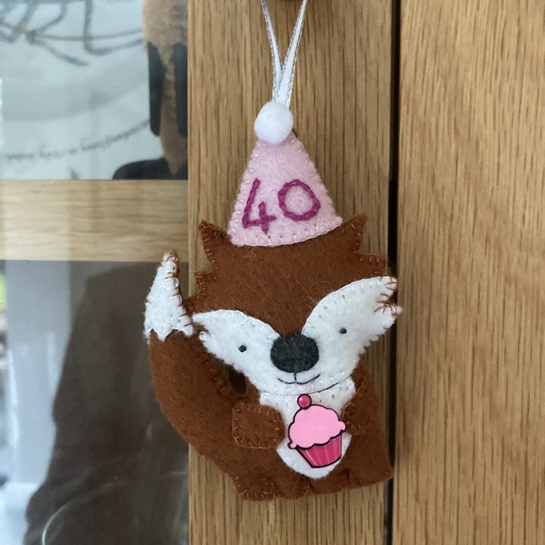 Little fox hanging on my dresser