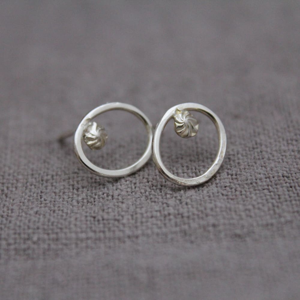 STERLING-SILVER-HAMMERED-OVAL-AND-STARBURST-HOOK-EARRING