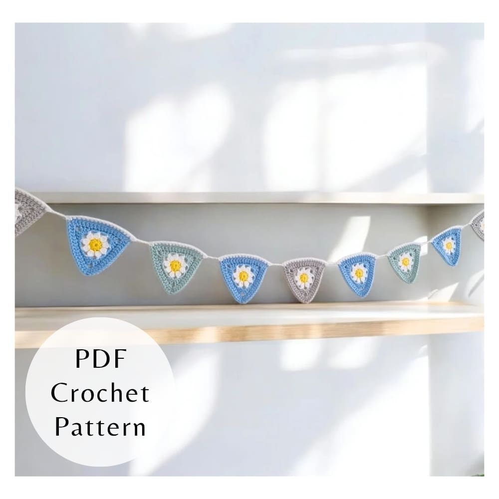 Digital PDF crochet pattern for triangle daisy bunting. Includes step-by-step photos and clear instructions for intermediate crocheters.