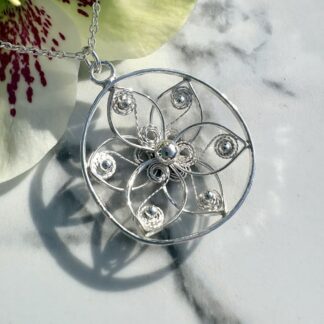 Circular-flower-pendant-in-sterling-silver-filigree-detail