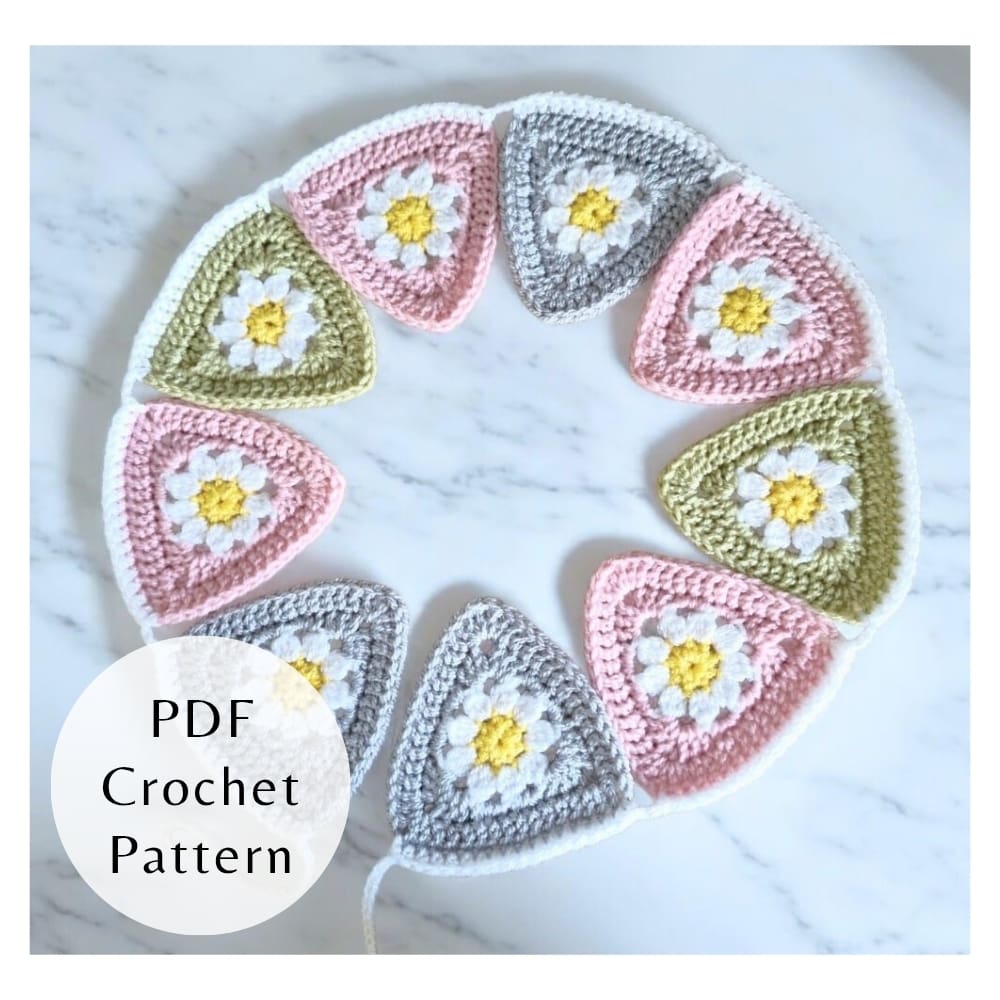 Digital PDF crochet pattern for triangle daisy bunting. Includes step-by-step photos and clear instructions for intermediate crocheters.