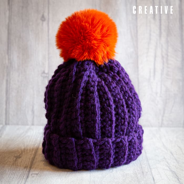 Crochet winter woolly bobble hat handmade in deep purple