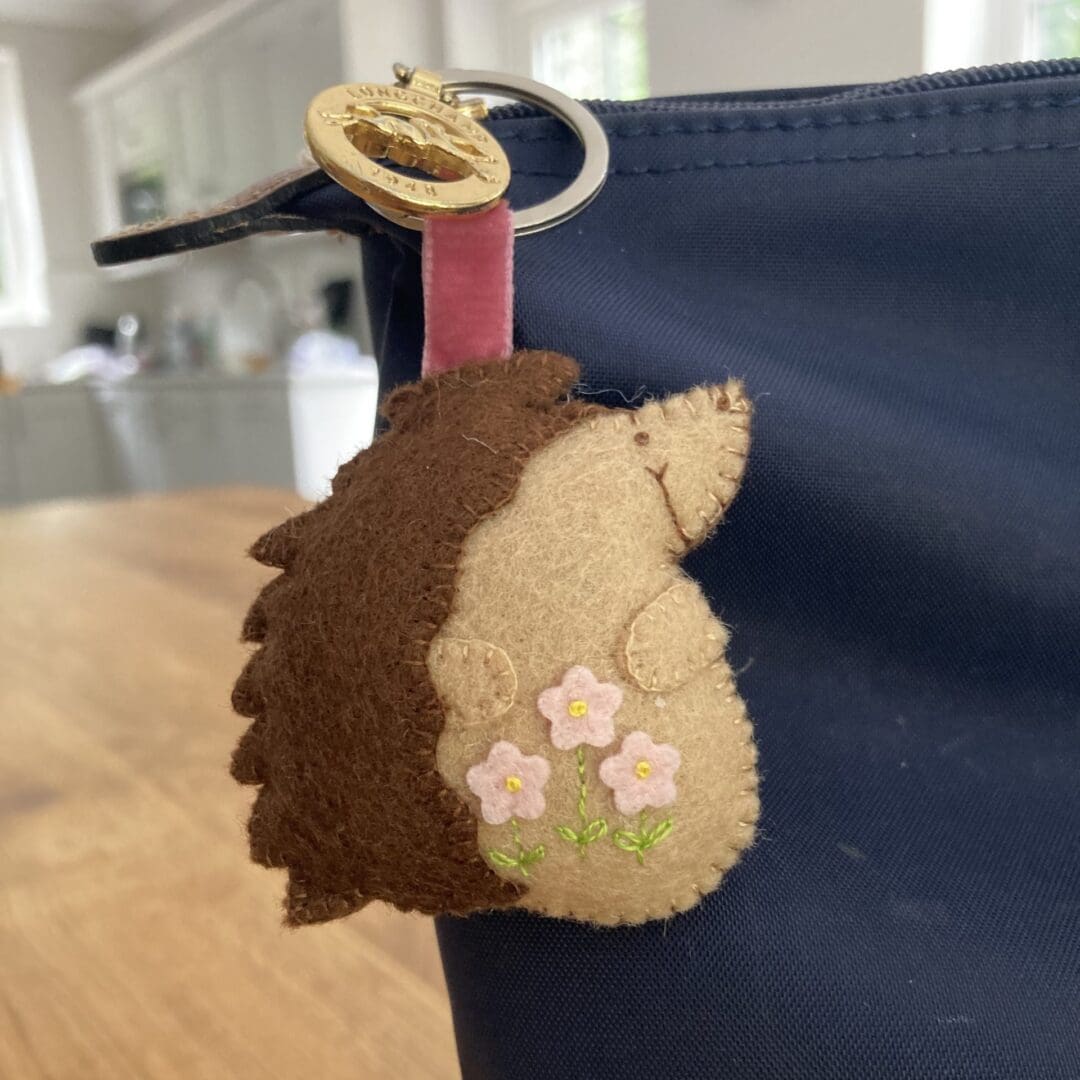 Hedgehog bag charm with pink flowers and pink velvet ribbon