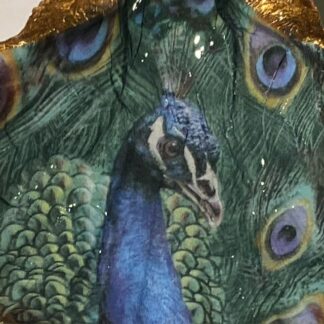 Handcrafted Decoupaged scallop shell featuring a stunning peacock