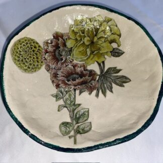 A handmade papier-mâché bowl featuring lovely modern florals.