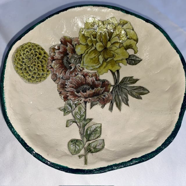 A handmade papier-mâché bowl featuring lovely modern florals.