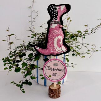 Pink floral fabric standing dog decoration with stitched happiness message