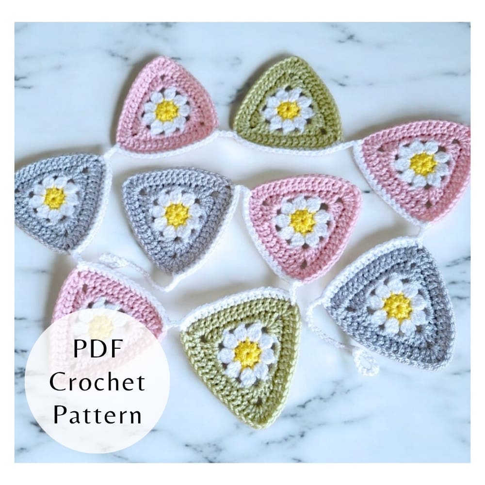 Digital PDF crochet pattern for triangle daisy bunting. Includes step-by-step photos and clear instructions for intermediate crocheters.