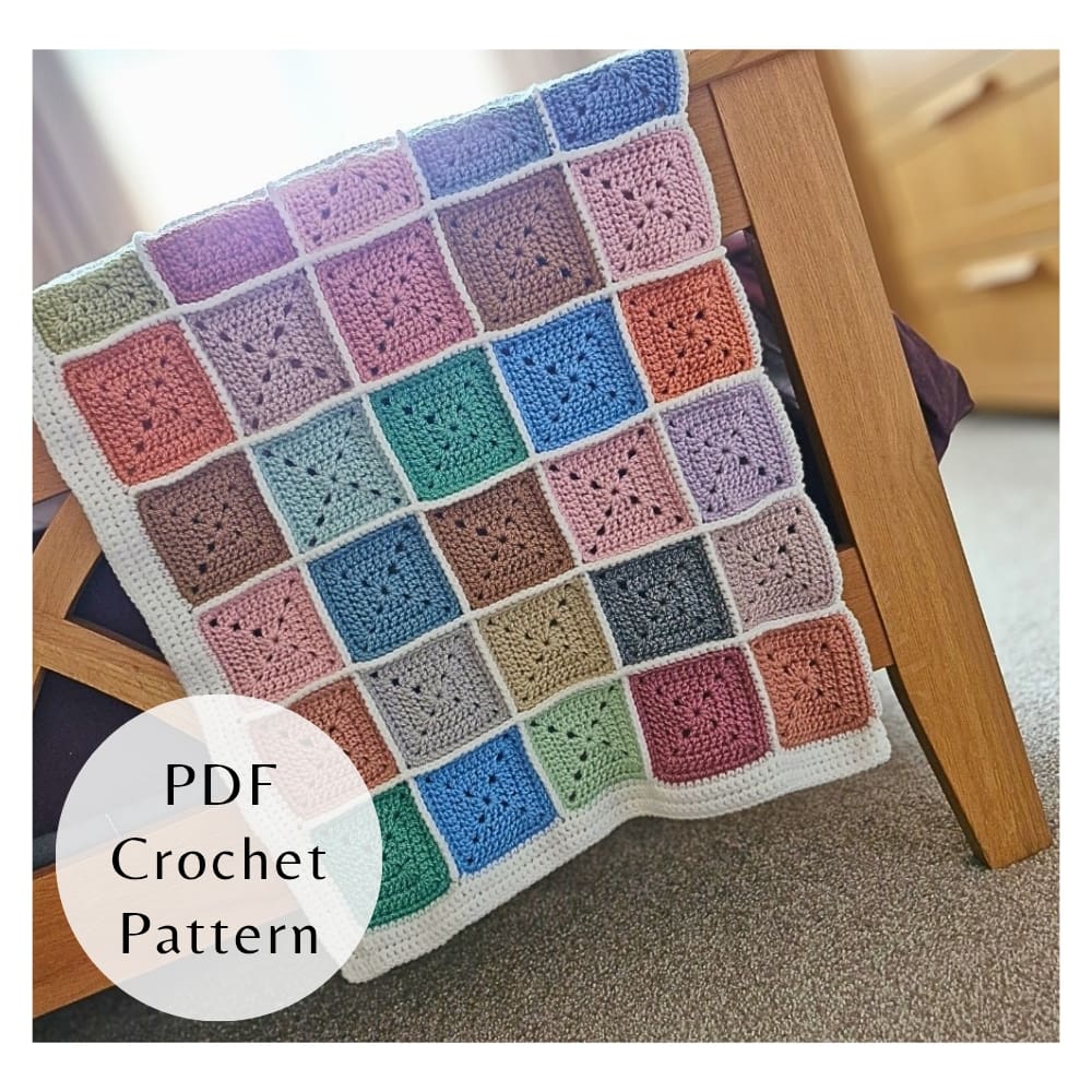 Handmade granny square style blanket using yarn leftovers