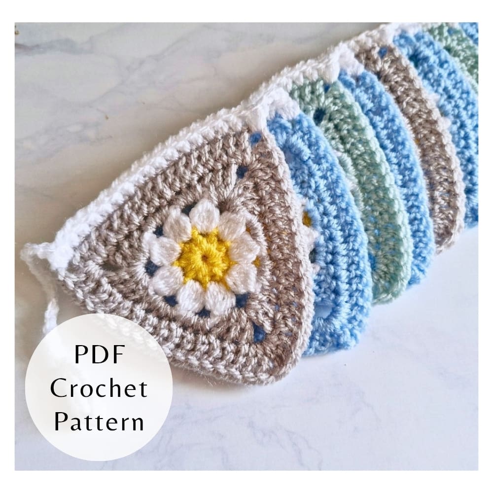 Digital PDF crochet pattern for triangle daisy bunting. Includes step-by-step photos and clear instructions for intermediate crocheters.