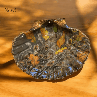 Handcrafted Decoupaged scallop shell featuring a stunning peacock feather design
