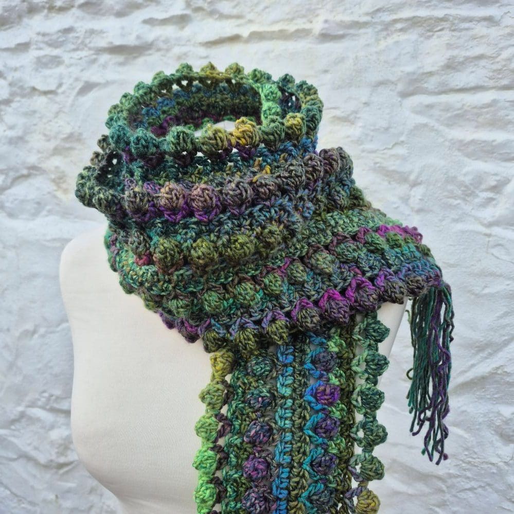 beautiful crocheted scarf purples greens