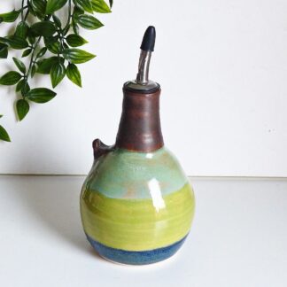 Wheel thrown handmade stoneware green olive oil bottle with pourer. Designed to look like a green olive.