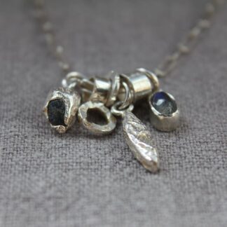 cluster necklace with mixed charms,- labradorite rough cast sapphire, cuttlefish cast hung on a paperclip chain