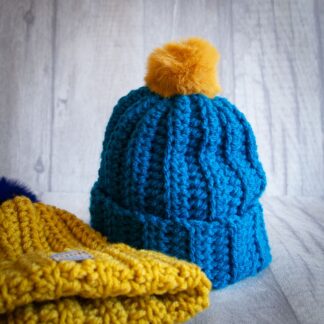 Handmade crochet toddler woolly hat with pom pom. Blue.