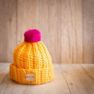 Handmade crochet toddler woolly hat with pom pom. Yellow.