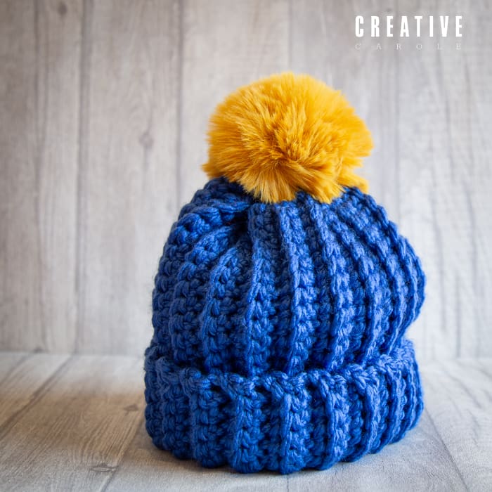 Crochet winter woolly bobble hat handmade in blue