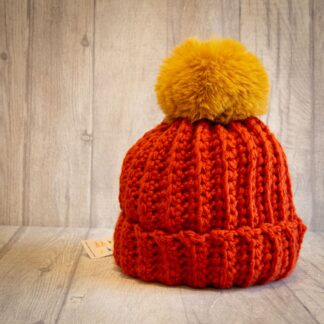 Crochet winter woolly bobble hat handmade in burnt orange