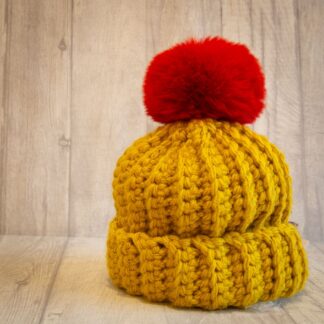 Crochet winter woolly bobble hat handmade in mustard