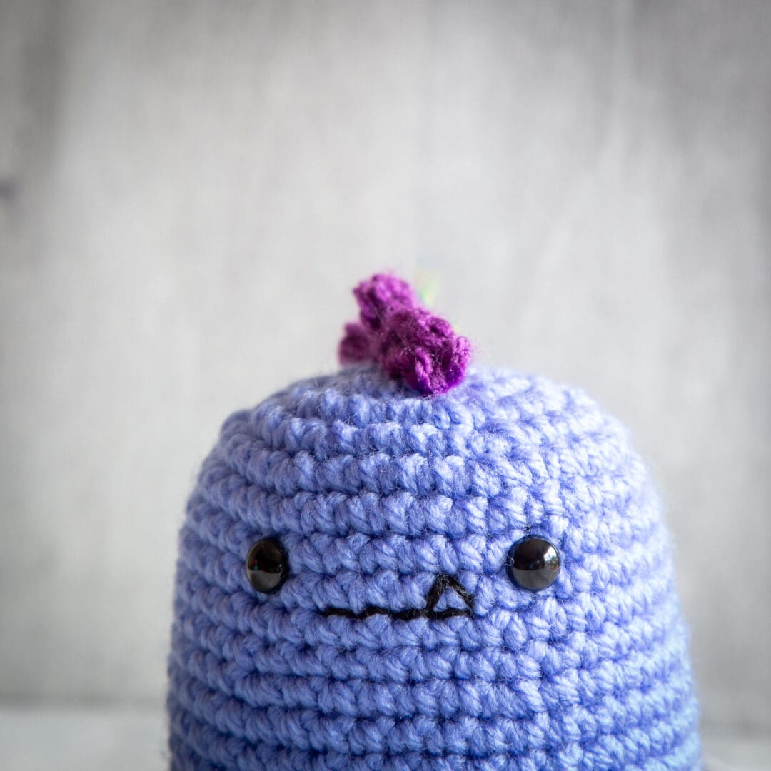Handmade crochet baby dinosaur ukca approved in lilac