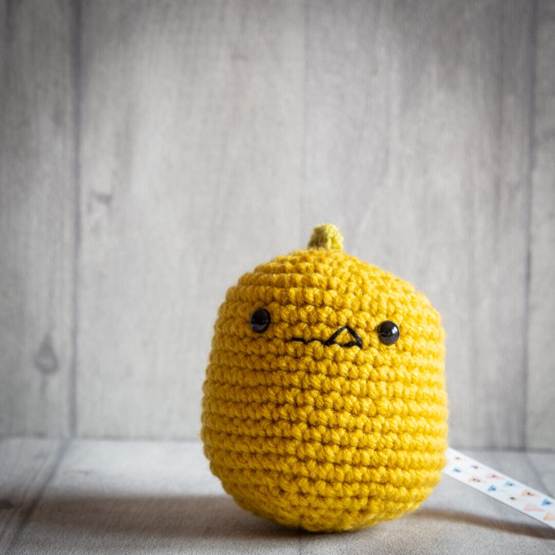 Handmade crochet baby dinosaur ukca approved in mustard