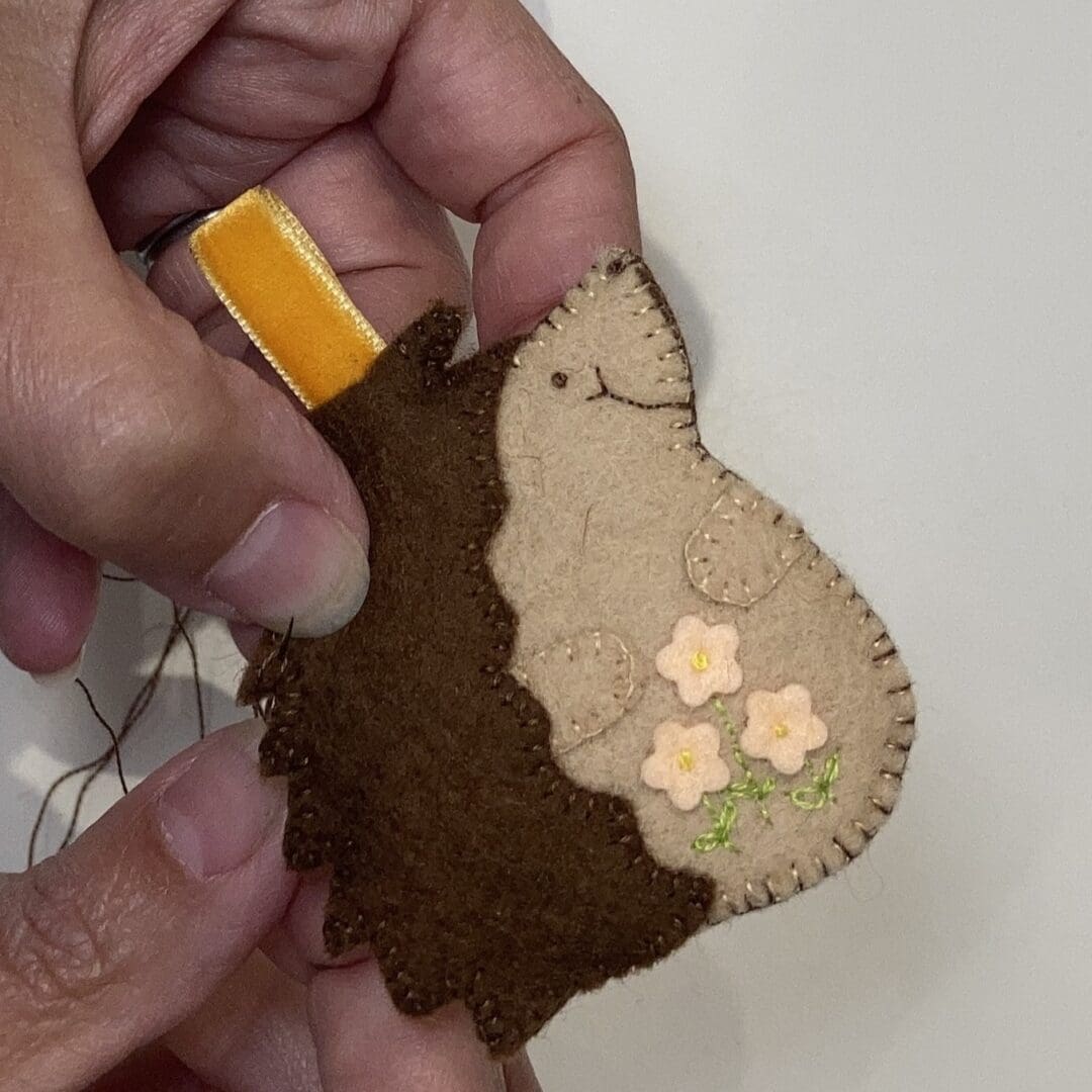 Hand sewing a hedgehog bag charm