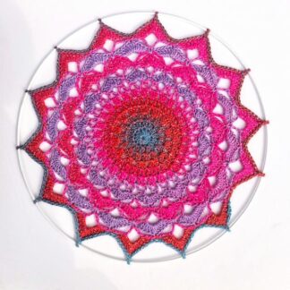 Handmade crochet mandala in glitter pink