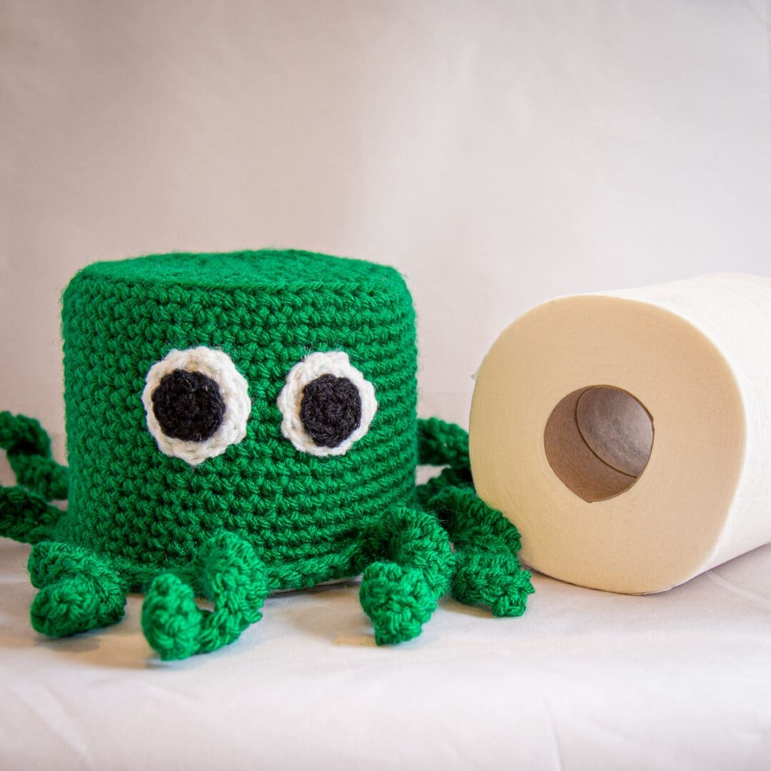 Handmade crochet octopus loo roll cover green