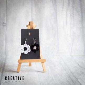 Handmade micro crochet earrings one black daisy one white daisy
