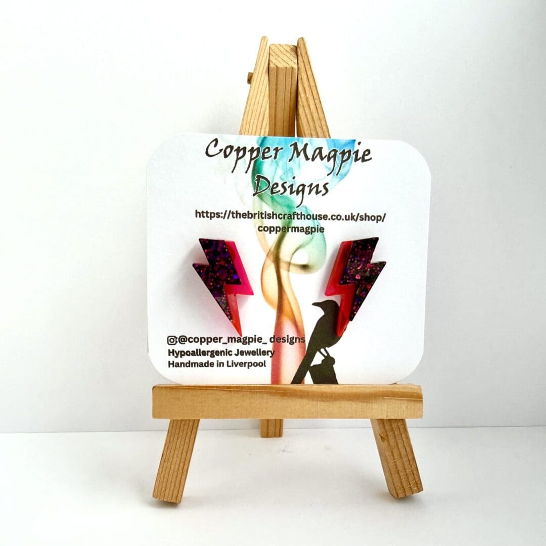 Handmade resin lightning bolt earrings displayed on earring card