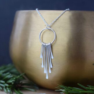 long silver drop pendant with paddle fringe
