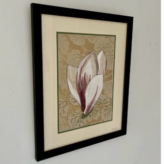 Hanging, framed textile art featuring a single stem magnolia bud on a gold background. Petals are white and burgundy with machine embroidery detail.