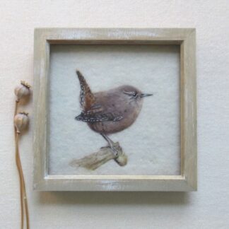 Tiny chestnut brown bird perched on a branch.