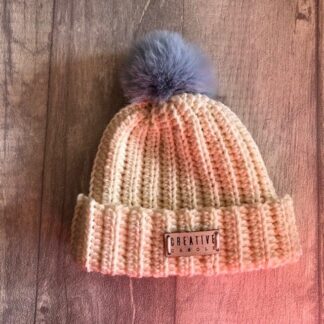 new born handmade crochet bobble hat in cream with blue pom pom
