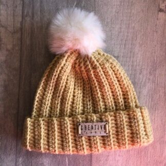 handmade crochet new born bobble hat. Super soft in dark cream with a cream pom pom
