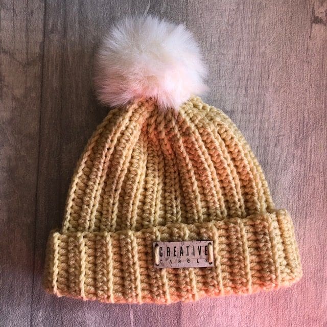 handmade crochet new born bobble hat. Super soft in dark cream with a cream pom pom