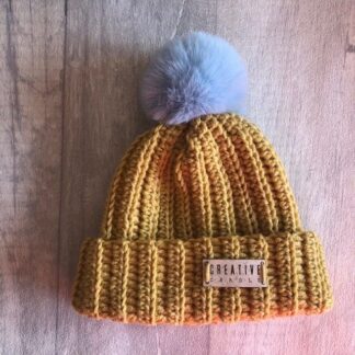 new born handmade crochet bobble hat in mustard with blue pom pom