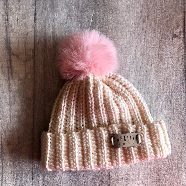 new born handmade crochet bobble hat in pale pink and pale pink pom pom