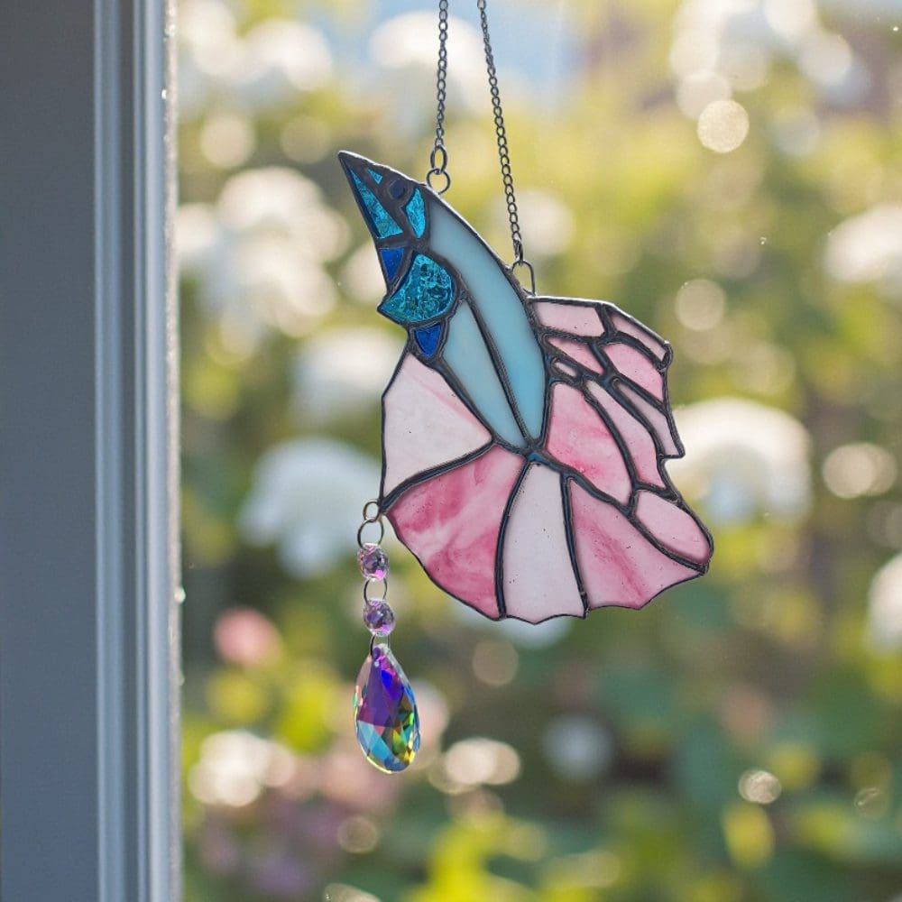 Handcrafted pink turquoise fish suncatcher with faceted crystal drop that scatters rainbows across the room in sunlight