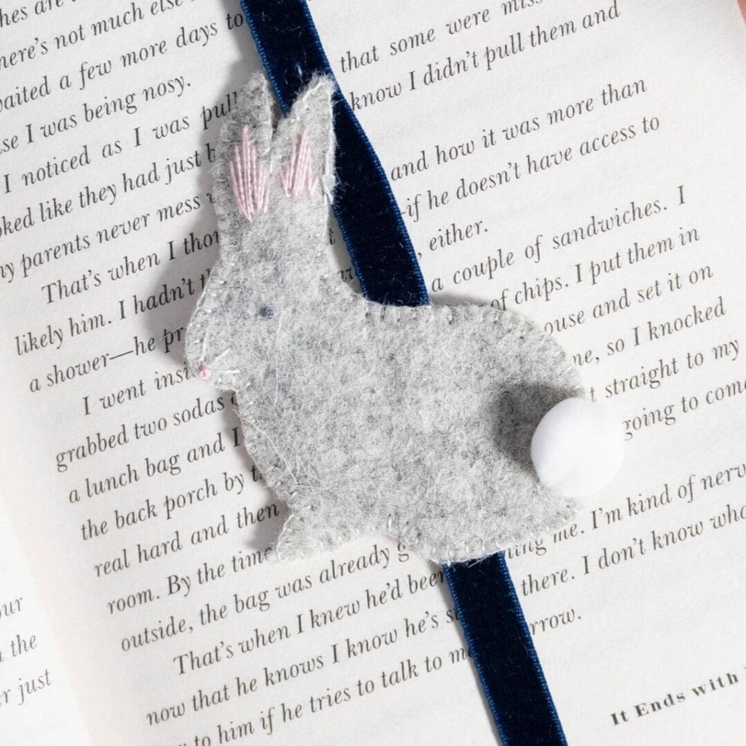 Close up of the grey rabbit showing it;s french knot for its eye and nose and it's whiskers